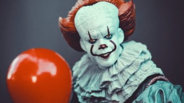 red ball on brown wooden surface