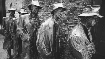 concrete statues near wall